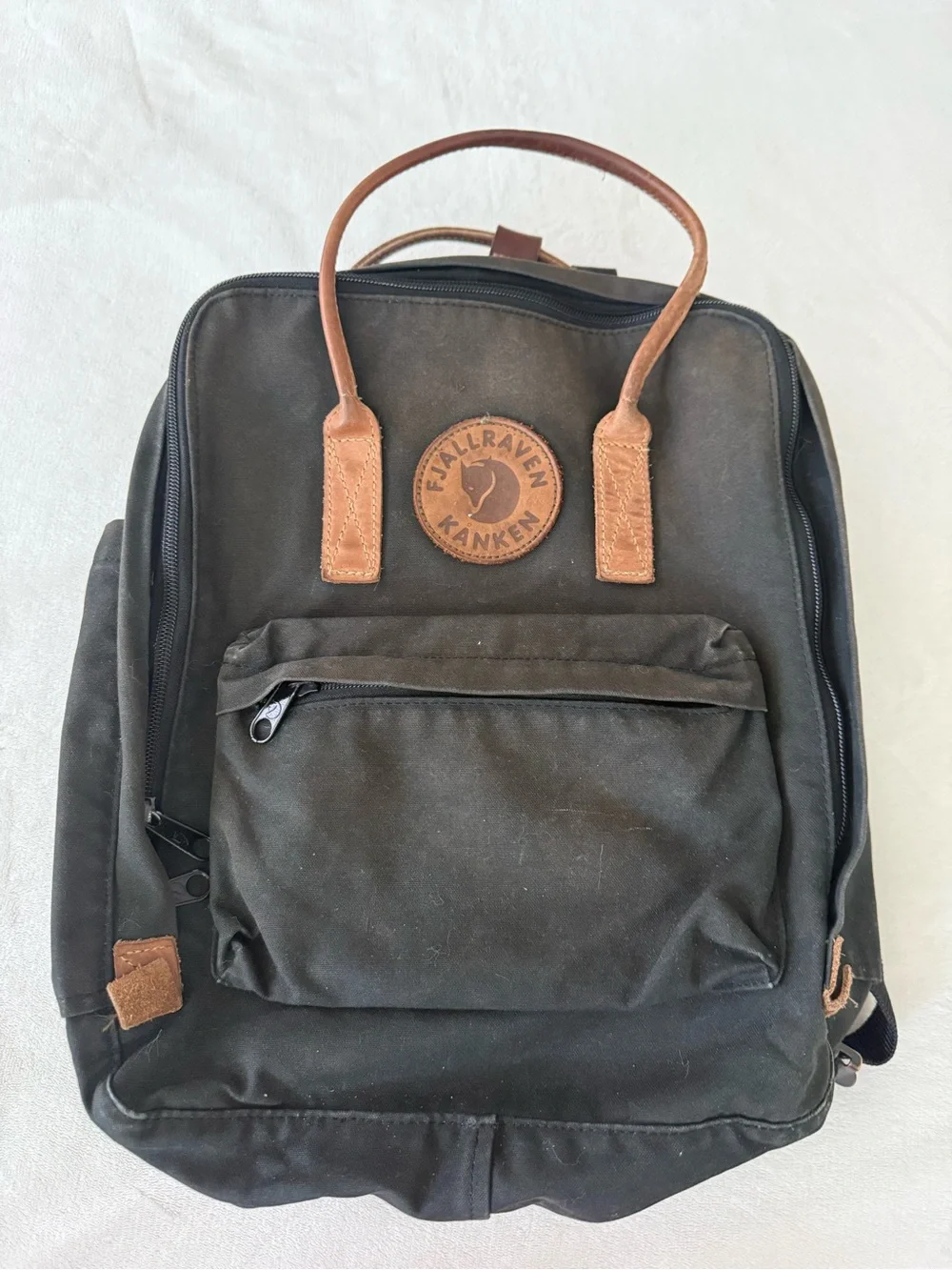Fjallraven Kanken Canvas Backpack in Black with Brown Leather Accents